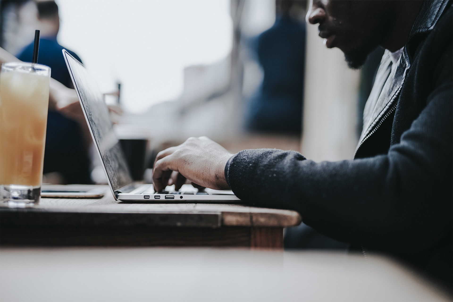 Businessman working remotely from a cafe.